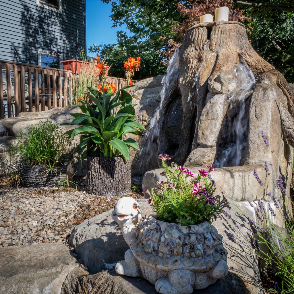 Carved Concrete Water Feature WNY western New York Chevalier outdoor living landscape build built stone brick space custom landscaping landscaper service beautiful unique construction install installation design garden maintenance